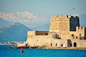 Bourtzi Fortress at scenic coastline, greece, nafplion