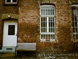 yard and facade of a brick house