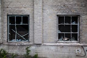 broken windows in a ruined building