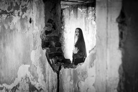 Gothic style Portrait of young Girl in ruined Building