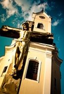 cross with a crucifix near the church