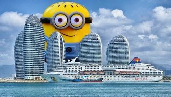 giant minion behind skyscrapers and cruise liner