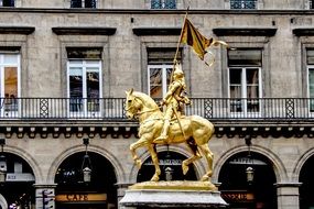 golden statue of Joan of Arc on a square in paris