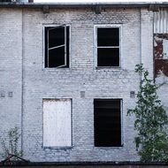 broken windows on a brick wall