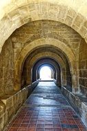 stone corridor with an arch