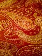 A textured pattern on the red Fabric