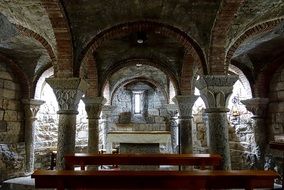 arches and columns in the interior of the beautiful church with window