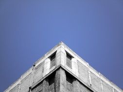 triangle top of masonry Building at sky