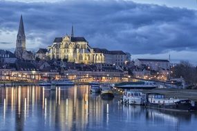 church with lanterns near the river