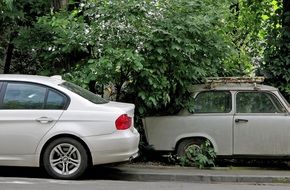modern and retro car in a parking lot in Bucharest