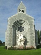 st george equestrian statue in niche at church, france, normandy