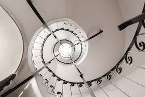 interior of spiral staircase in a white room