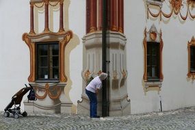 woman near traditional home in upper bavaria