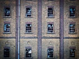 Old Brick Facade with broken Windows