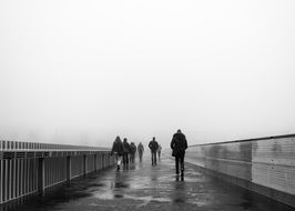 people on the city bridge