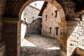 stone arch near the building, spain, cantabria