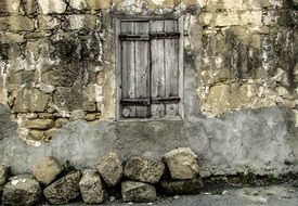 shuttered window in an abandoned house