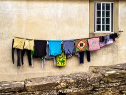 bright Clothing Hanging on line at wall