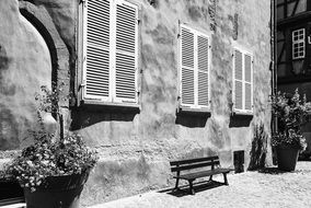 side view of a building with shutters in france