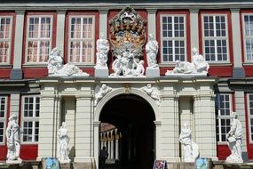 stone statues on the facade of the house of the old city in lower saxony