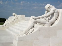 white sculptures on the stairs