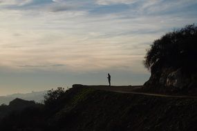 tourist on a hill at dusk in california