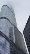 Glass skyscraper top in Fog, usa, illinois, Chicago