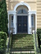 green staircase in front of the house