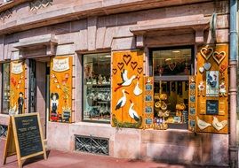 strikingly drawings on wooden shutters on beautiful Facade