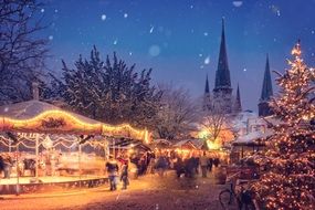 Christmas fair in the lights of garlands