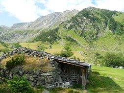 aged Herdsman House in mountain valley