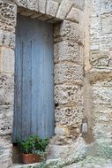 Blue wooden door in old house