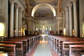 interior in a church with wooden benches