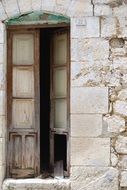 open door to a stone building