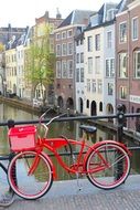 Red bike on a bridge