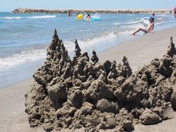 wet sand castle on the beach