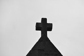 stone cross on church