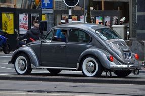 grey retro volkswagen beetle on street