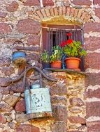 vintage decorated window in red sandstone wall, spain, Prades