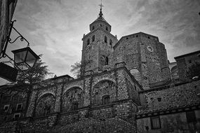 low angle view of aged brick Cathedral, black and white, Spain, Aragon