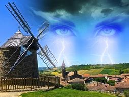 windmill against the sky with eyes