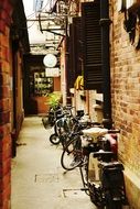 bicycles on a narrow street in shanghai