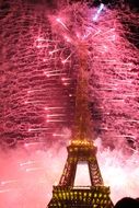 pink fireworks over eiffel tower