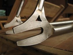 Bicycle parts on a wooden board