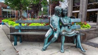 sculpture lovers on the bench