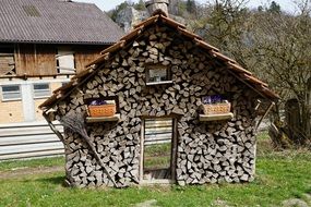 Decorative house made of logs