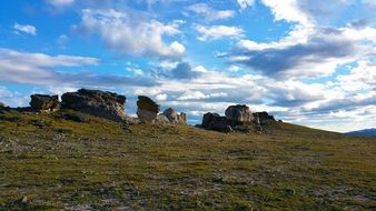 rocks on a green hill