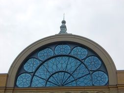 arched glass window on the building