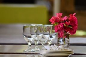 wine Glasses and Plates on table in restaurant