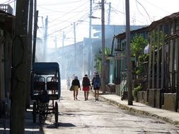 tourists walk around the city in Cuba